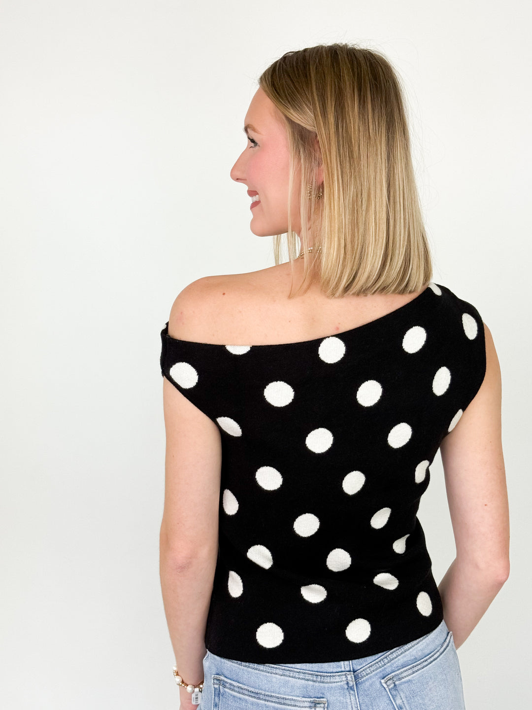 Lola - Black Polka Dot Asymmetrical Neck Knit Top